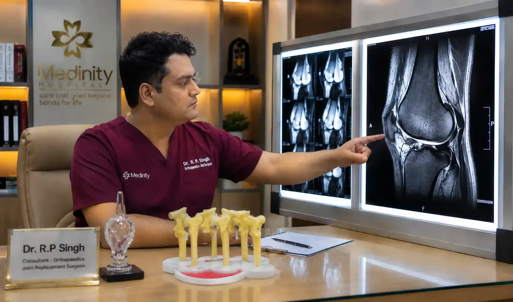 Dr. R.P. Singh reviewing MRI scan for sports injury diagnosis at Medinity Hospital Lucknow